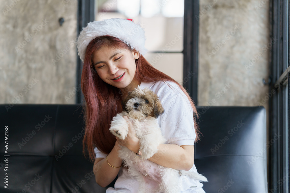 Asian woman relax on sofa in holiday with her dog, pet lover. Asian woman relax on sofa in holiday with her dog, pet lover.