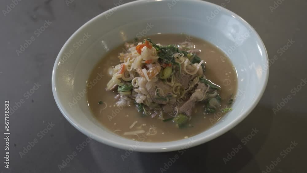 Close up to boiled and fried Pork Thai Menu with Shrimp Paste in white bowl that ready to serve and eat. Close up to boiled and fried Pork Thai Menu with Shrimp Paste in white bowl that ready to serve and eat.