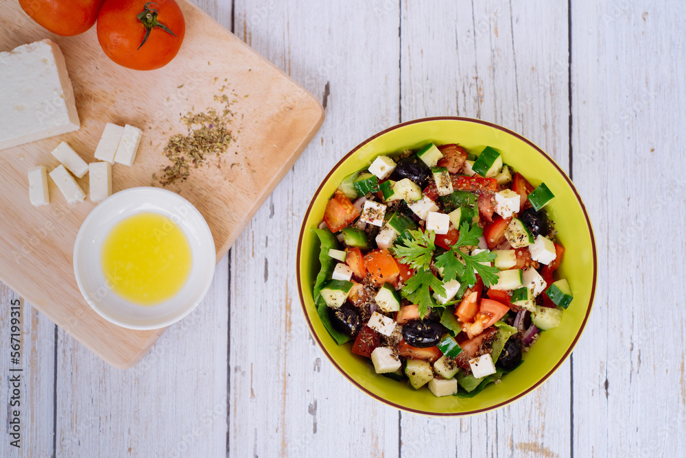 Healthy salad in a bowl on a wooden table Healthy salad in a bowl on a wooden table
