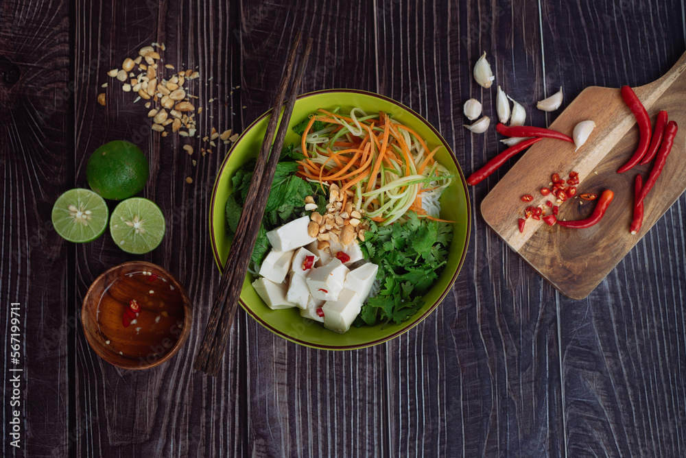 Healthy salad in a bowl on a wooden table Healthy salad in a bowl on a wooden table