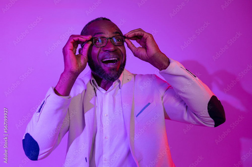 Obraz premium happy man puts on glasses for vision. happy to see the world. hold glasses in hands