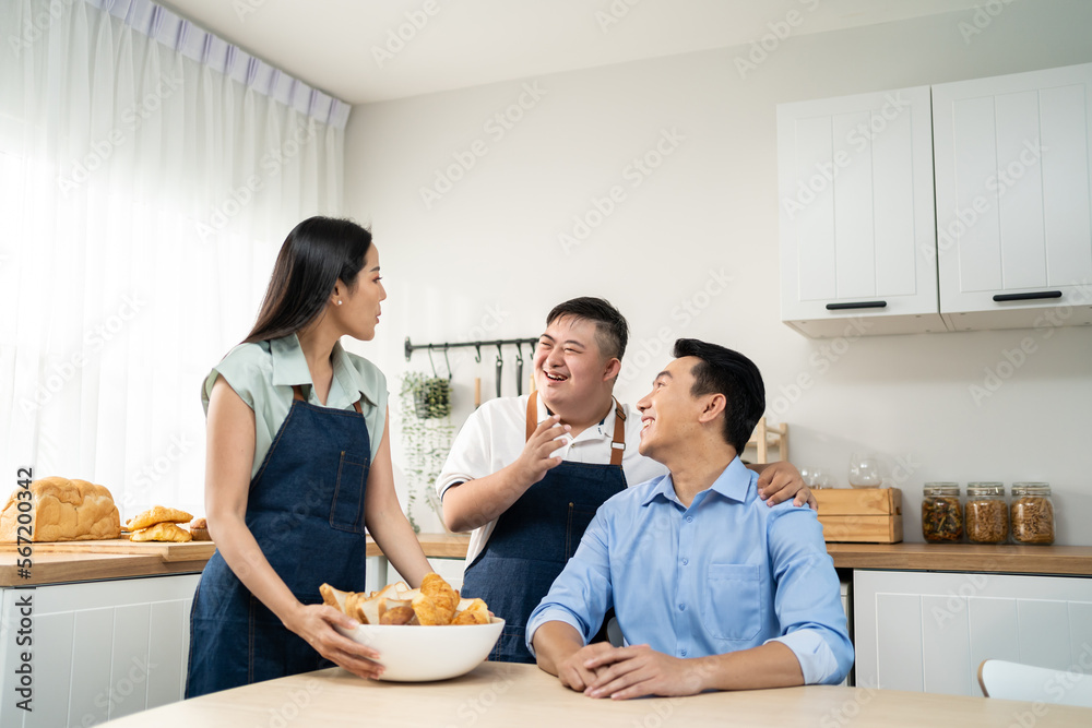 Asian happy family, mature parents baking bakery with son in kitchen. 