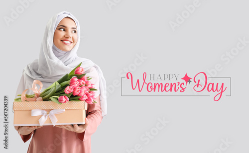 Muslim woman with tulips an...