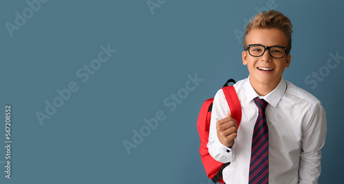 Happy teenage boy with back...