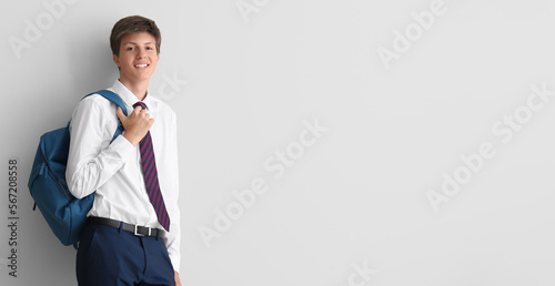 Happy teenage boy with back...