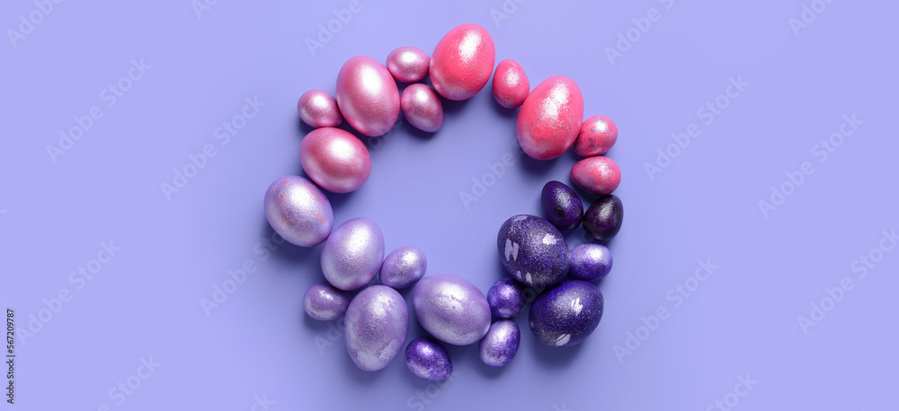 Frame made of beautiful Easter eggs on lilac background Frame made of beautiful Easter eggs on lilac background