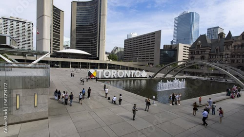 Hyperlapse of people at popular tourist spot in Nathan Philips Square in Toronto photo
