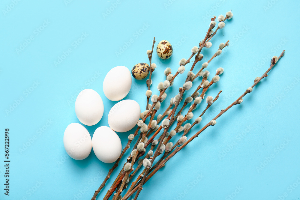 Willow branches and Easter eggs on color background Willow branches and Easter eggs on color background