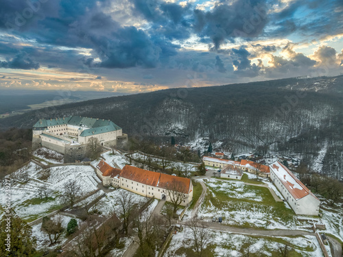 Aerial view of Cerveny Kamen (Vorosko, Red stone) castle a former stronghold of a noble family with four round bastions for cannon gun platforms in the Carpathian mountains in Slovakia dramatic sunset