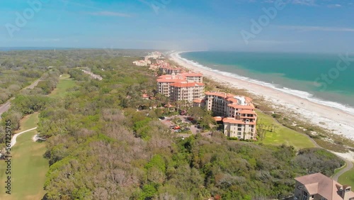 Aerial view of coastal resorts in the forests of Amelia Island with background of the  beach photo