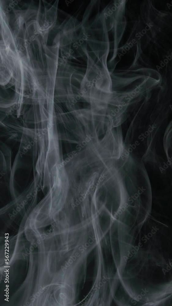 Slow motion vertical video of white smoke, fog, mist, vapor on a black background. Slow motion vertical video of white smoke, fog, mist, vapor on a black background.