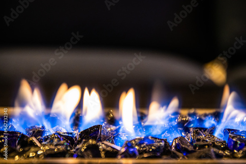 A close-up of the flames in a home fire pit in long exposure.