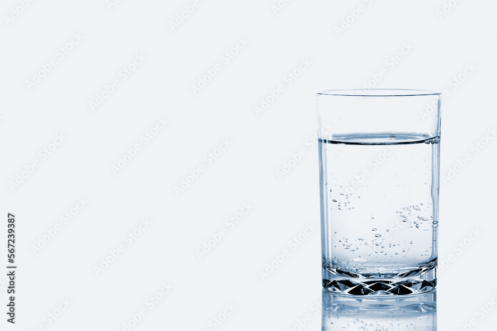 A Glass of soda fizzy of water with bubbles isolated on white background. A Glass of soda fizzy of water with bubbles isolated on white background.