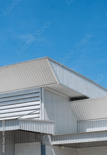 metal sheet roofing on commercial construction with blue sky © showcake