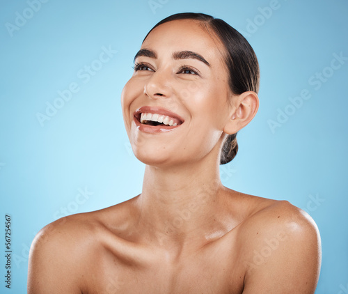 Billede på lærred Face, thinking and beauty skincare of woman in studio isolated on a blue background
