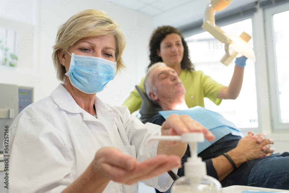 Obraz premium dentist pumping hygienic gel