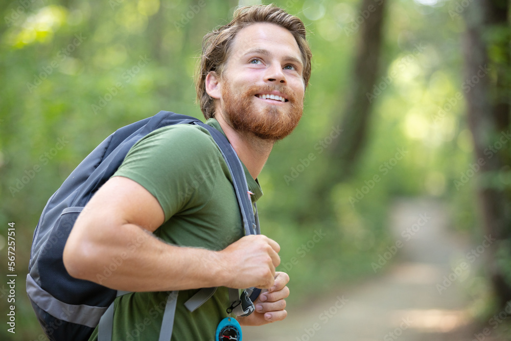 attractive hiker with big traveling rucksack moving up attractive hiker with big traveling rucksack moving up