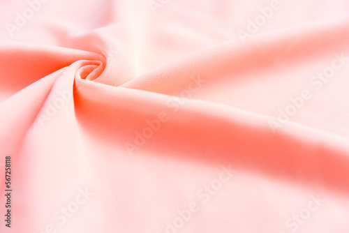 Light pastel pink folded fabric as a background