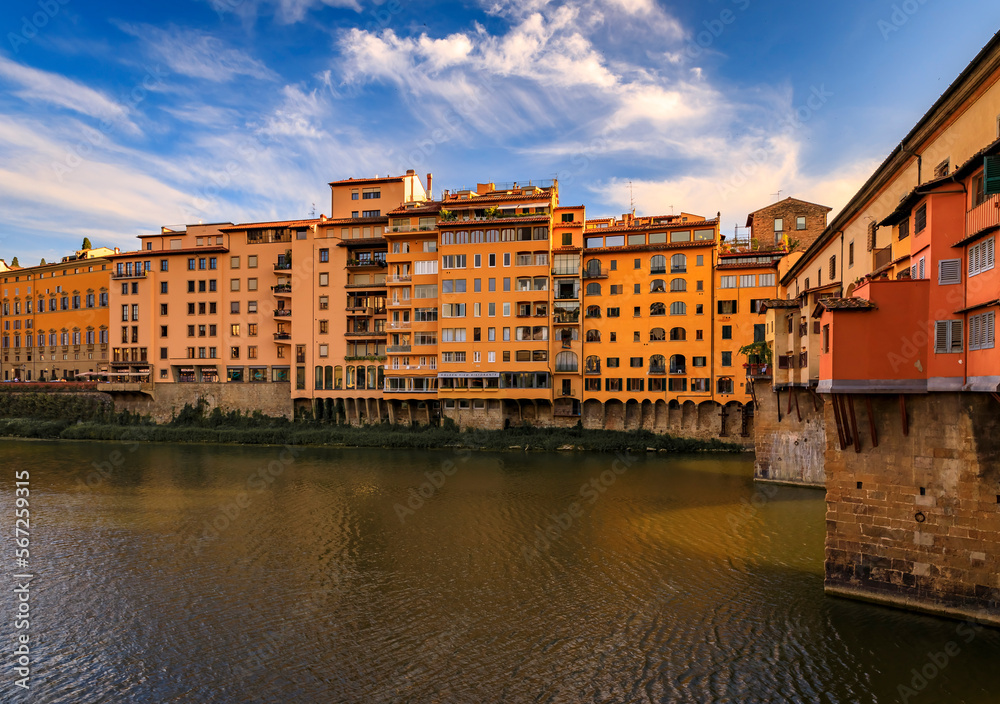 Famous Ponte Vecchio bridge with silversmith shops on Arno River, Florence Italy