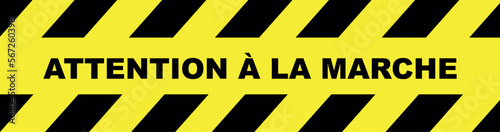 ATTENTION À LA MARCHE text on yellow background. MIND YOUR STEP in french language.