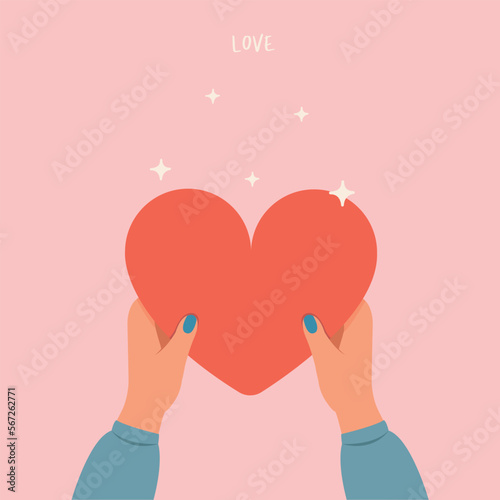 Hand holding heart, share love to people, charity and donation hands with heart concept.