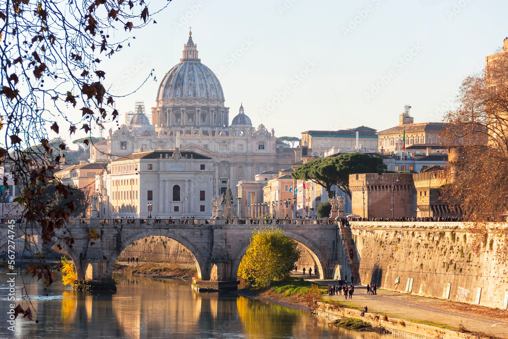 St. Peter Basilica over bridge and Tiber river. Winter in Rome, Italy