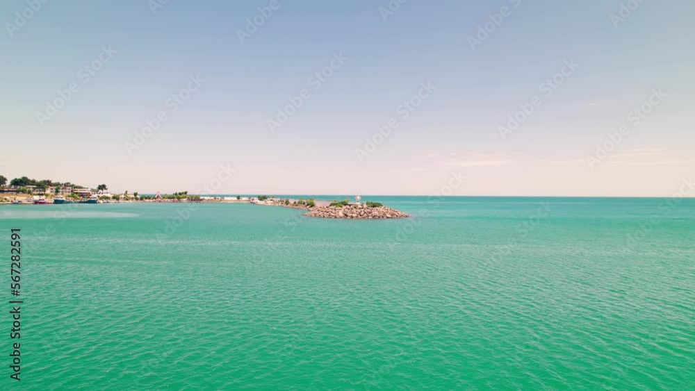 Aerial shot of a seaside town from the sea. Sea view of Gerze town of Sinop. Lighthouses and a seaside view on a sunny summer day. Gerze, Sinop, Turkey, 4K Aerial shot of a seaside town from the sea. Sea view of Gerze town of Sinop. Lighthouses and a seaside view on a sunny summer day. Gerze, Sinop, Turkey, 4K