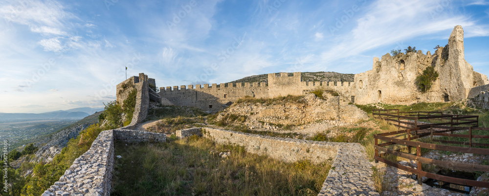 Panorama of ruins of a medieval castle with vegetation coming back