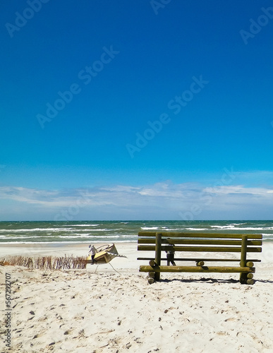 Bench on beach in Stilo, Baltic Sea coast, Poland. photo