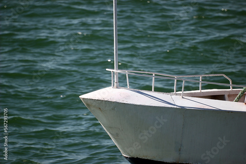 The nose and railing of the ship close-up on the background of the sea 