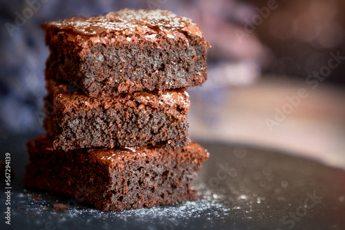 Bilde på lerret Homemade dark chocolate fudge brownies cake stacked on stone plate with copy space