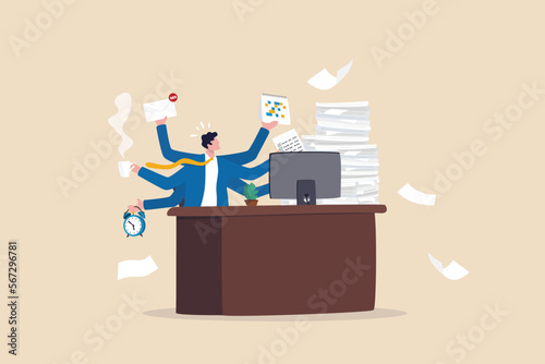 Workaholic, busy businessman multitasking or tired and exhausted from overworked, overload job, lot of paper works concept, workaholic businessman working hard on his office desk with paper works. photo