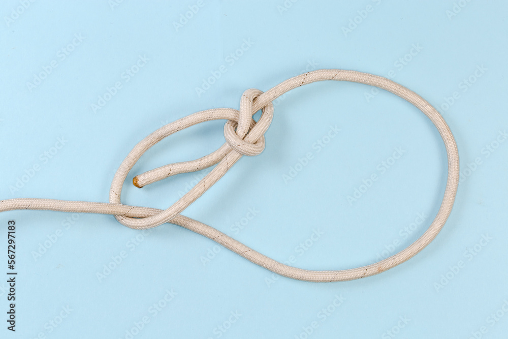 Rope knot Running bowline on a blue background Rope knot Running bowline on a blue background