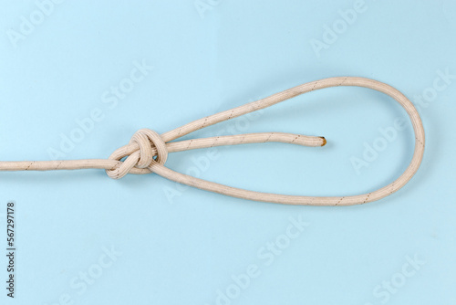 Rope knot double bowline on a blue background