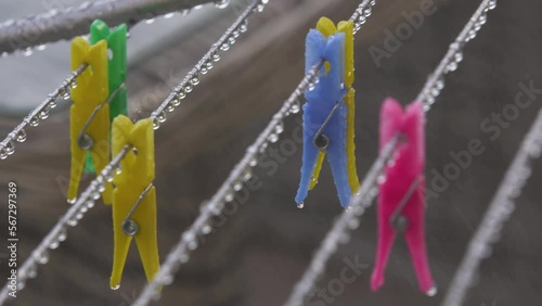 Wet colors clothespins in the rain