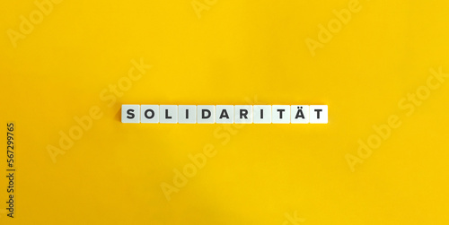 Solidarität Word (Solidarity in German Language). Letter Tiles on Yellow Background. Minimal Aesthetics.