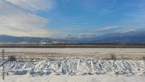 View of the winter landscape from a window of going train