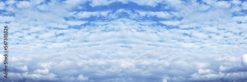 Blue cloudy sky wide background. Heaven cloudscape, clouds. Nature skyscape widescreen wallpaper