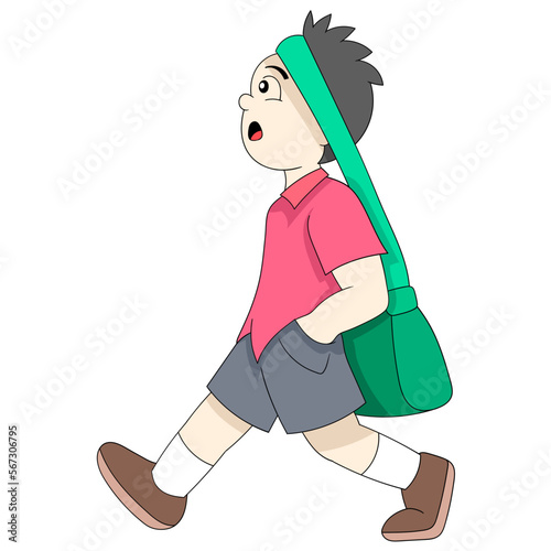boy was walking leisurely carrying a bag to school