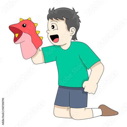 boy is telling a funny story using a hand puppet photo