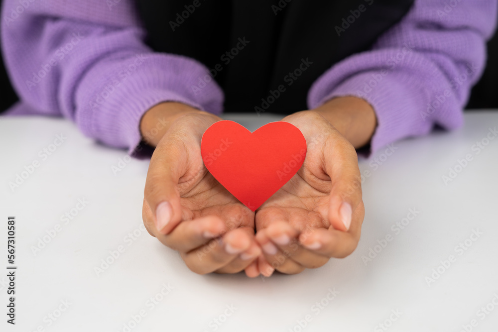 female holding love shape paper for valentines and romance symbol female holding love shape paper for valentines and romance symbol