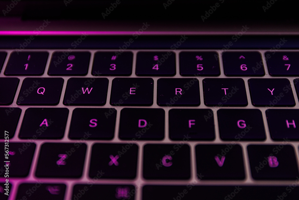 QWERTY keyboard close-up shot. QWERTY is a keyboard layout for Latin-script alphabets