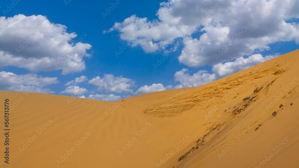 wide sandy dune in desert under a blue sky time lapse scene wide sandy dune in desert under a blue sky time lapse scene