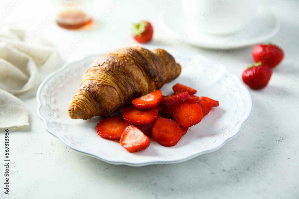 Freshly made croissants with berries