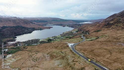 The R251 next to the snow covered Mount Errigal, the highest mountain in Donegal - Ireland. photo