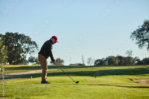 senior man playing golf