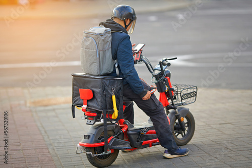 Photography Online delivery service, delivering food with e-scooter