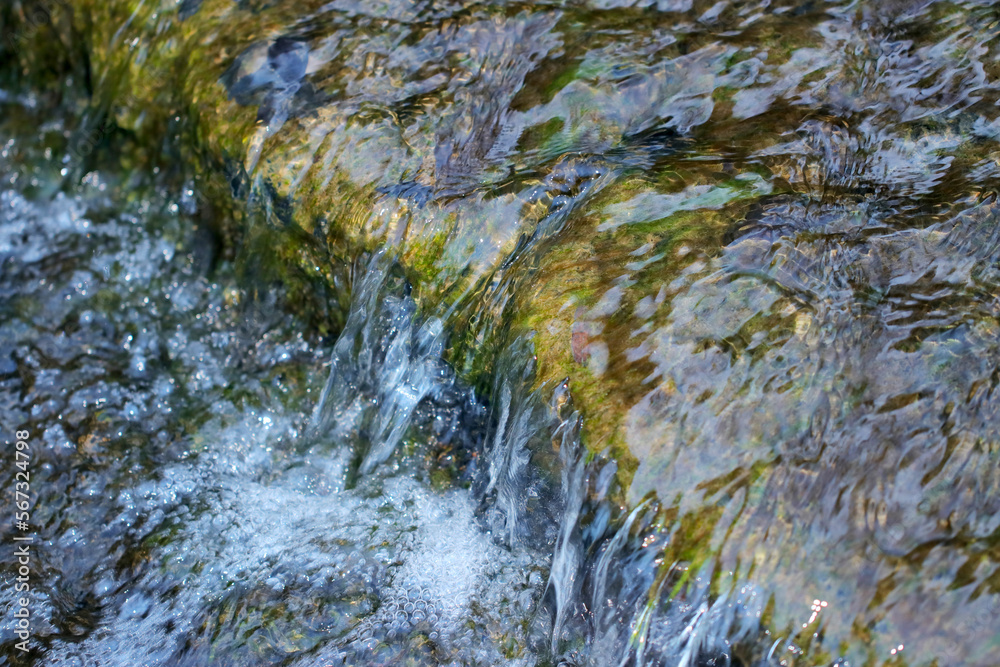 Scenery of a small stream waterfall in the mountain. Scenery of a small stream waterfall in the mountain.
