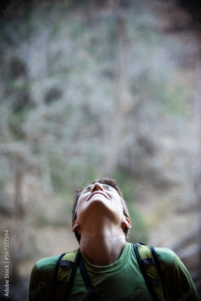 Portrait of a female hiker looking up. Portrait of a female hiker looking up.