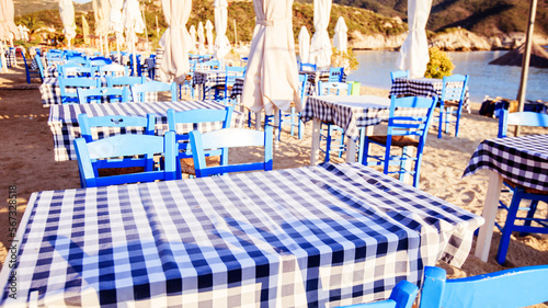 Traditional Greek restaurant, taverna on the beach at morning. photo